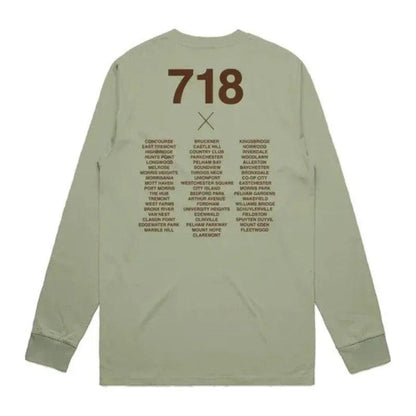 Green long-sleeve shirt with text on the back on a white background