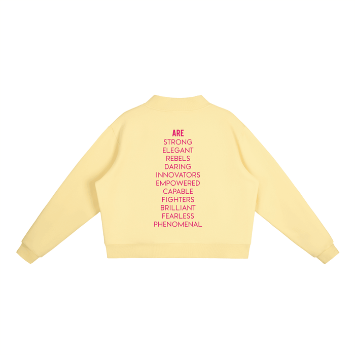 Yellow cropped hoodie with bold pink empowering words, NYC streetwear style