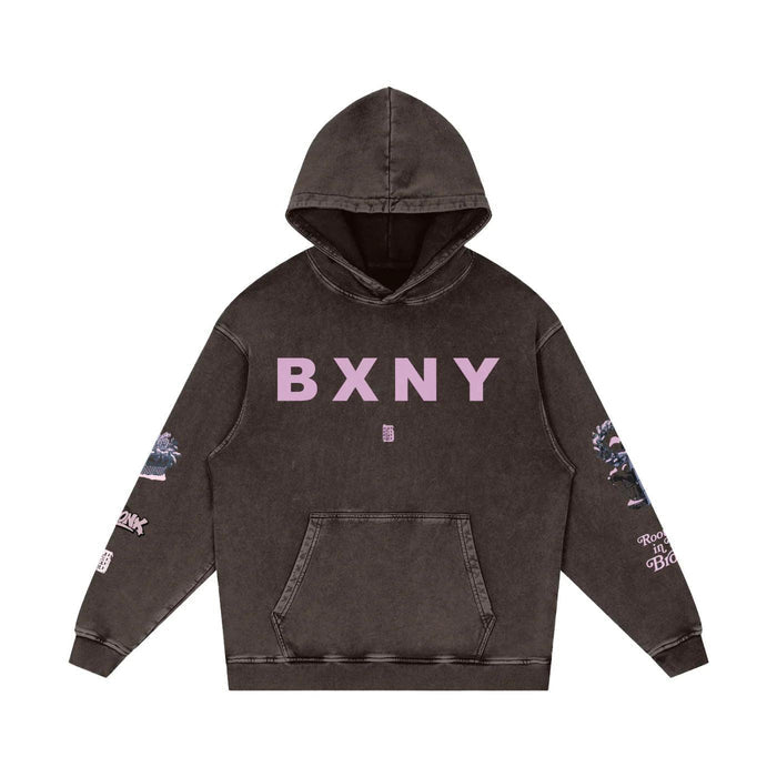 Dark washed hoodie with pink BXNY lettering, floral sleeve prints, and front pocket — urban streetwear style