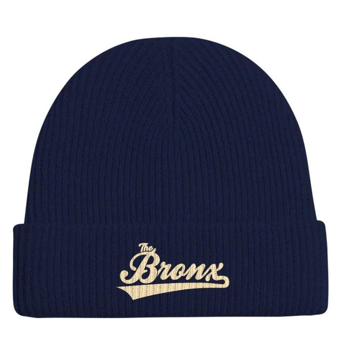 Navy blue ribbed beanie with gold 'The Bronx' script, NYC streetwear style winter hat