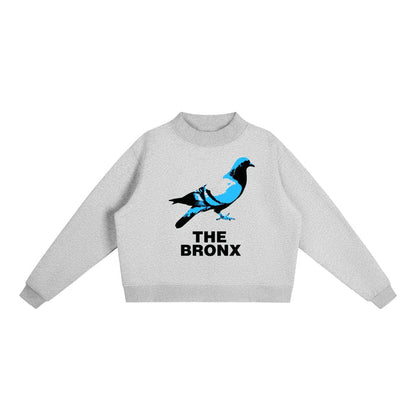 Gray hoodie with blue and black pigeon graphic and 'THE BRONX' text, NYC streetwear style